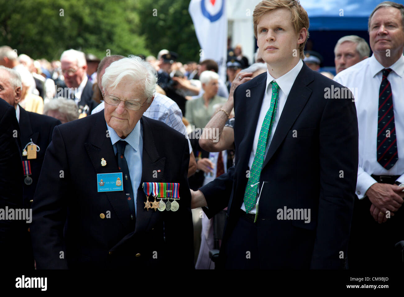 London, UK. 28/06/2012. Veterans and their families gather in Green park for a service to watch as the memorial to the 55,573 airmen of Bomber Command who died during World War II was unveiled. Some 6000 attended the ceremony.  Stock Photo