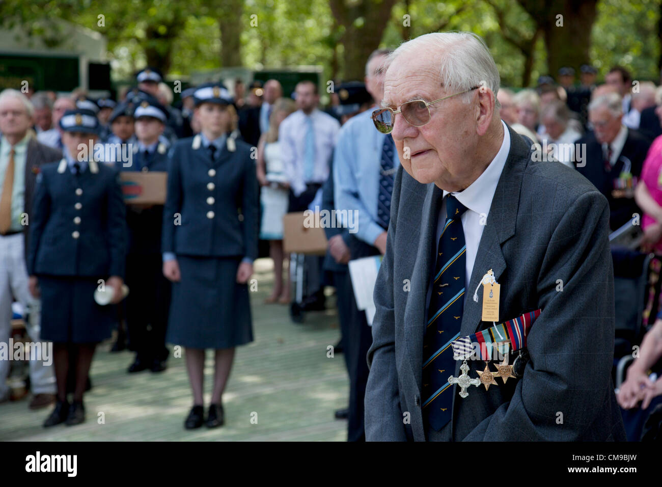 London, UK. 28/06/2012. Veterans and their families gather in Green park for a service to watch as the memorial to the 55,573 airmen of Bomber Command who died during World War II was unveiled. Some 6000 attended the ceremony.  Stock Photo