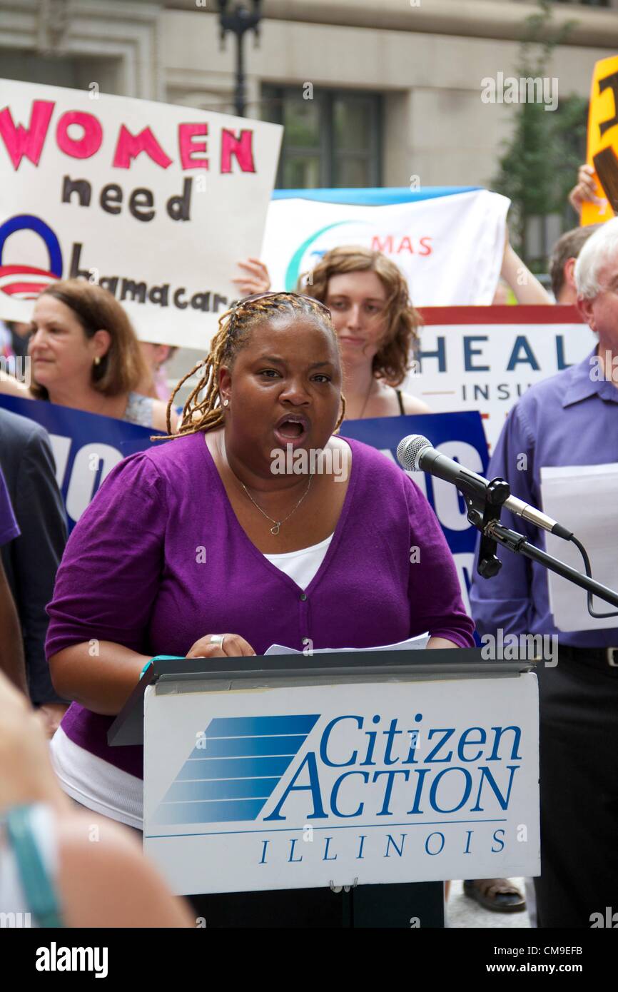 Chicago, Illinois, USA, 28, June, 2012. April Verrett of SEIU Health Indiana/Illinois addresses crowd gathered in Daley Center Plaza to celebrate the upholding of the Affordable Care Act by the U.S. Supreme Court. The Court upheld the law in a 5-4 decision with conservative Chief Justice John Roberts siding with the Court's four liberal justices. Stock Photo