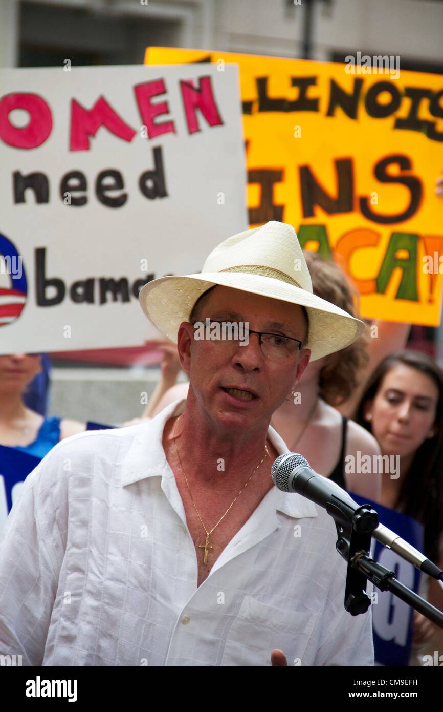 Chicago, Illinois, USA, 28, June, 2012. Will Wilson, a man suffering from HIV/AIDS, addresses crowd gathered in Daley Center Plaza to celebrate the upholding of the Affordable Care Act by the U.S. Supreme Court. The Court upheld the law in a 5-4 decision with conservative Chief Justice John Roberts siding with the Court's four liberal justices. Stock Photo