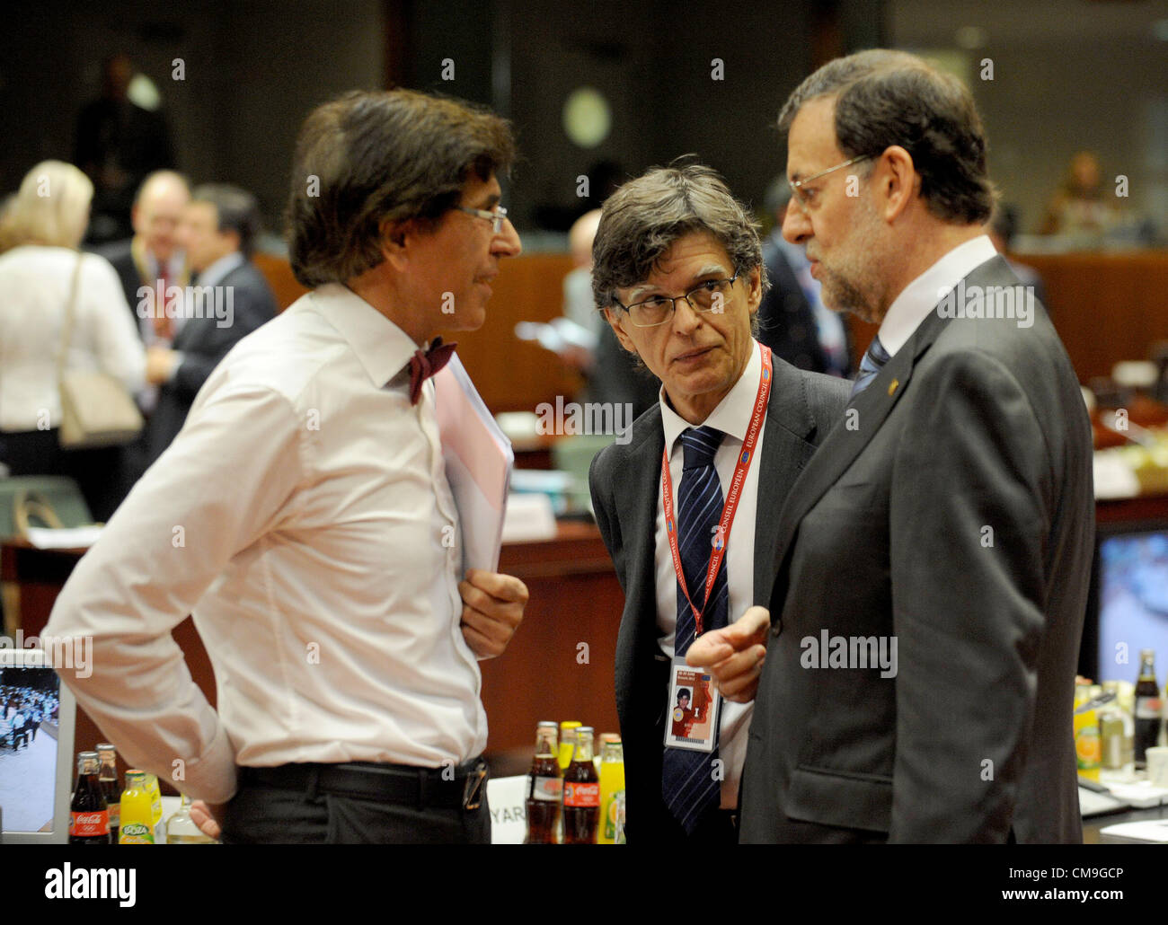 June 29, 2012 - Brussels, Belgium - Belgium's Prime Minister Elio di Rupo talks with Spanish Prime Minister Mariano RAJOY helped by a interpreter prior to the last meeting with leaders of the EU..European EU leaders agreed after overnight meetings in Brussels to use bailout fund to recapitalise struggling banks helping Spain, which sought a Ã›100 billion ($A124.66 billion) rescue to help its troubled banks and is facing rising borrowing costs..EU President Herman Van Rompuy called it a ''breakthrough that banks can be recapitalised directly''. EU President Herman Van Rompuy say leaders of the  Stock Photo