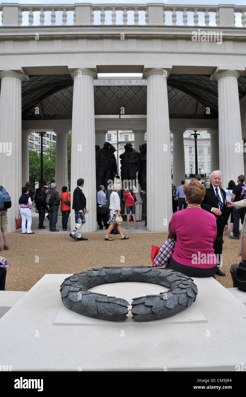 Green Park, London, UK. 29th June 2012. People look at the memorial to the Airmen of Bomber Command which was unveiled by the Queen yesterday. The pavilion is designed by Liam O'Connor, with sculptures by Sculptor Philip Jackson. Stock Photo