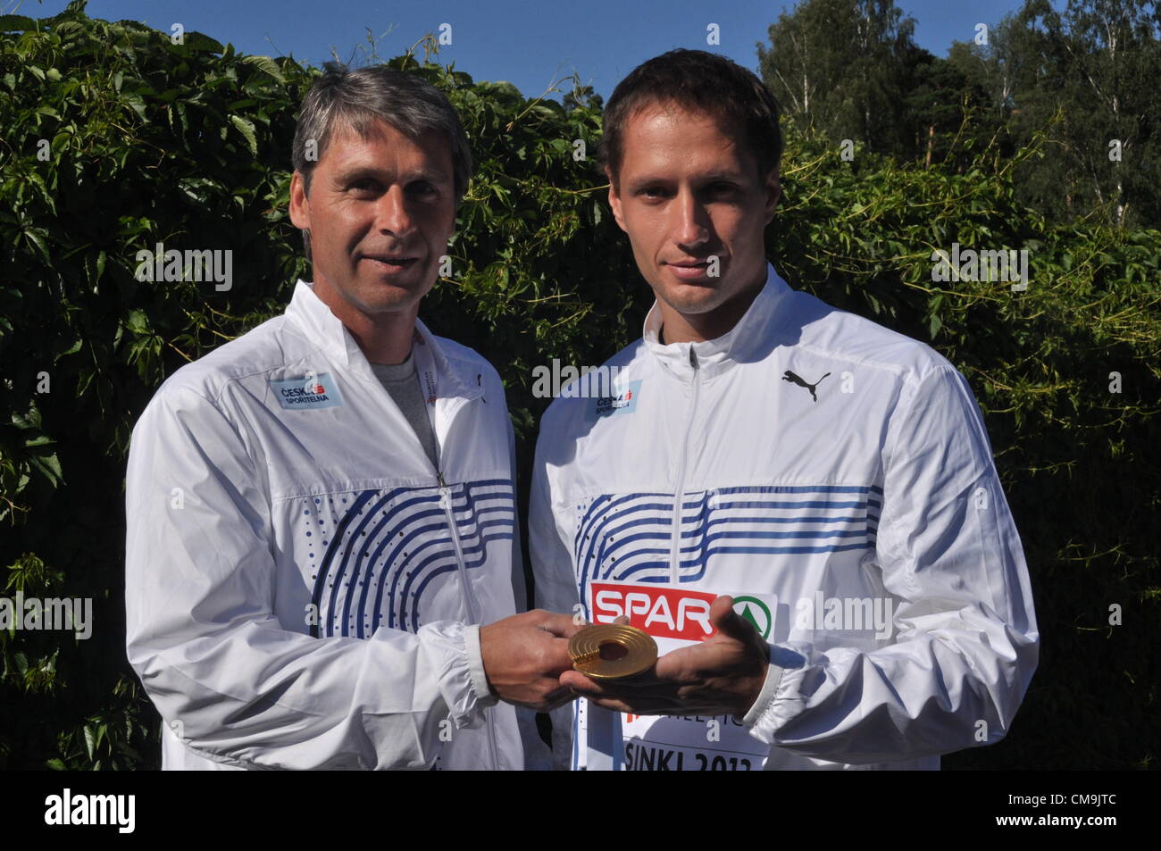 Czech javelin thrower Vitezslav Vesely (right) and his coach Jan