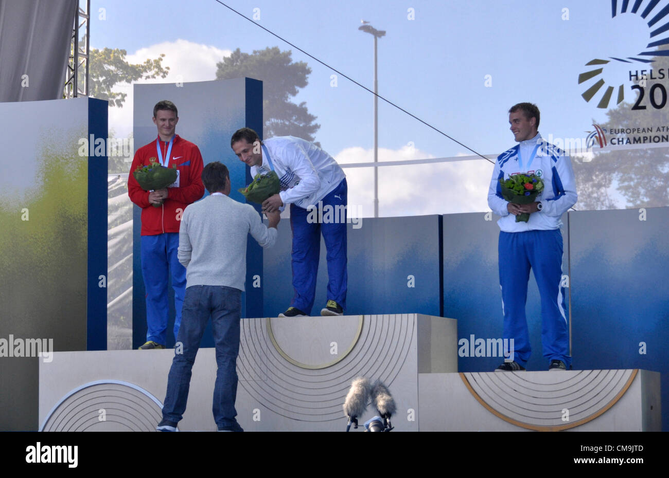 Czech javelin thrower Vitezslav Vesely (centre) receive congratulations