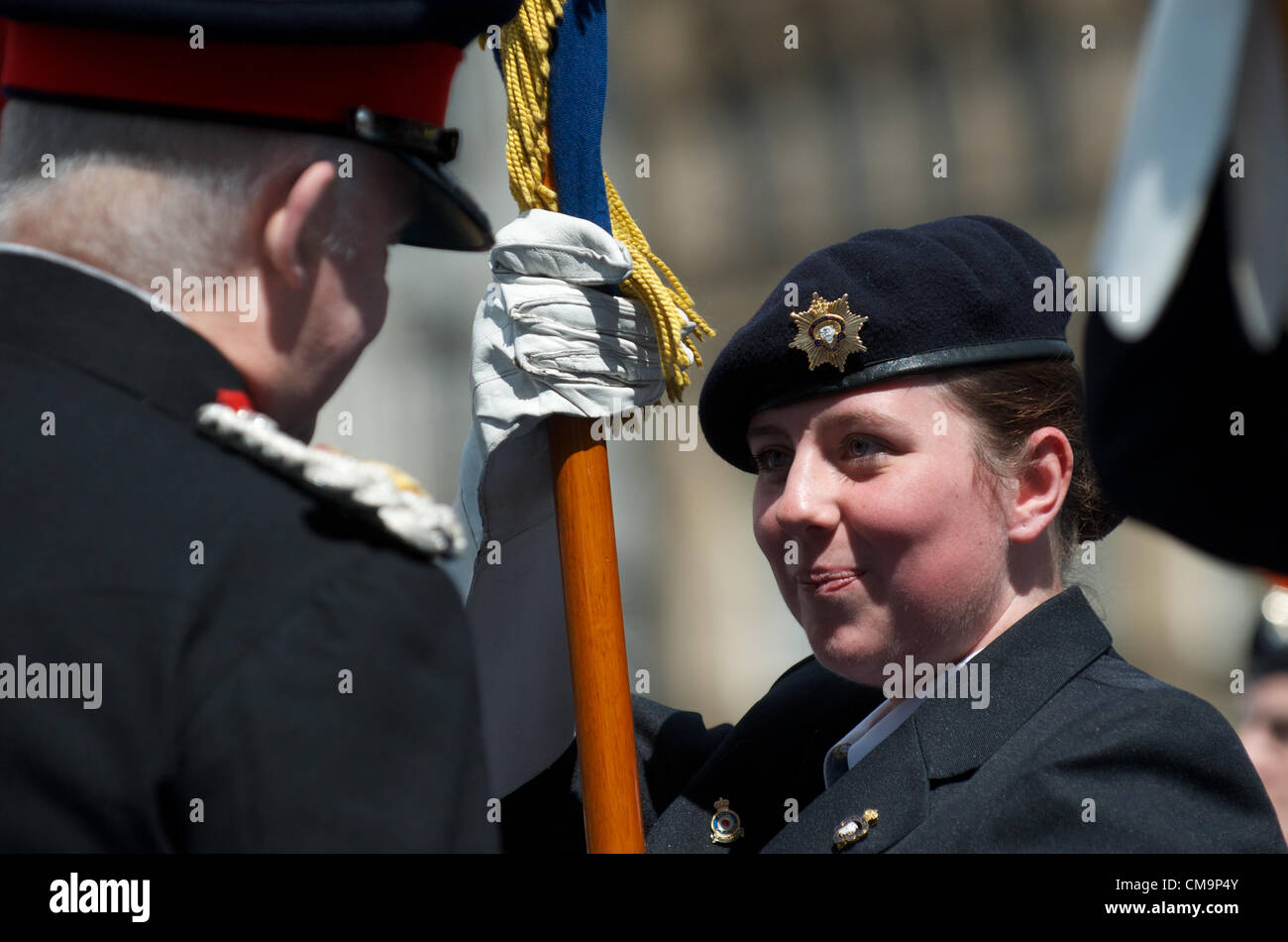 Manchester, UK. 30-06-2012 - Female member of the Royal British Legion shows pride as she is spoken to by the Lord Lieutenant at the Armed Forces Day ceremony, Piccadilly, Manchester. Stock Photo