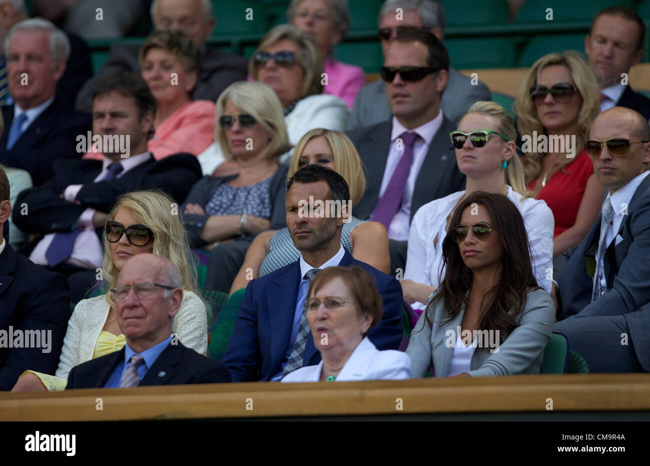 30.06.2012 The All England Lawn Tennis and Croquet Club. London, England. Giggs at Centre Court at The Championships Wimbledon, Lawn Tennis Club - London - Ryan Giggs and Sir Bobby Charlton in the royal box Stock Photo