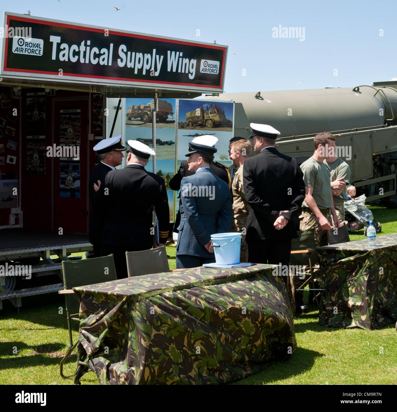 Plymouth, UK. 30 June, 2012. Armed forces officers in dress uniform gather at the stand of the Tactical Supply Wing of the RAF, on Plymouth Hoe, on National Armed Forces Day 2012 Stock Photo