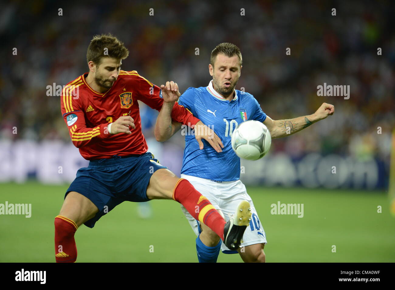 01.07.2012 Kiev, Ukraine.  Spain's Gerard Pique (L) and Italy's Antonio Cassano challenge for the ball during the UEFA EURO 2012 final soccer match Spain vs. Italy at the Olympic Stadium in Kiev, Ukraine, 01 July 2012. Stock Photo