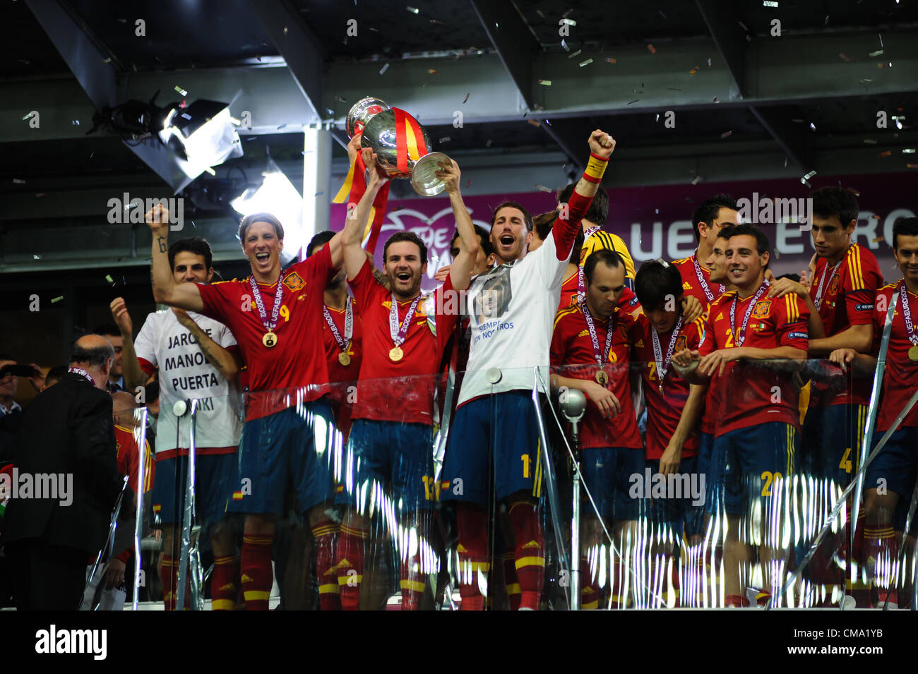 07.01.2012 , Kiev, Ukraine. Fernando Torres, Juan Mata and Sergio Ramos hold up the winners trophy. Spain celebrate winning the European Championship Final game between Spain and Italy from the Olympic Stadium. Stock Photo