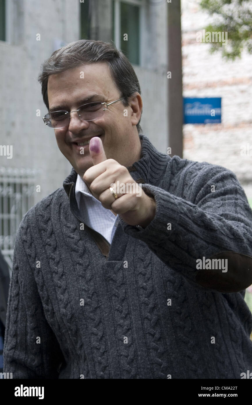 June 30, 2012 - Mexico, Distrito Federal, MEX - Mexico City's mayor, Marcelo Ebrad  flashes his election ink-stained thumbs after he cast his vote in the general election in Mexico City, Mexico Sunday, July 1, 2012.  Mexicans began voting for a new president on Sunday. According to polls, the PRI, holds a sizeable lead in these elections, after losing the top office12 years ago. (Credit Image: © Abril Cabrera/Prensa Internacional/ZUMAPRESS.com) Stock Photo