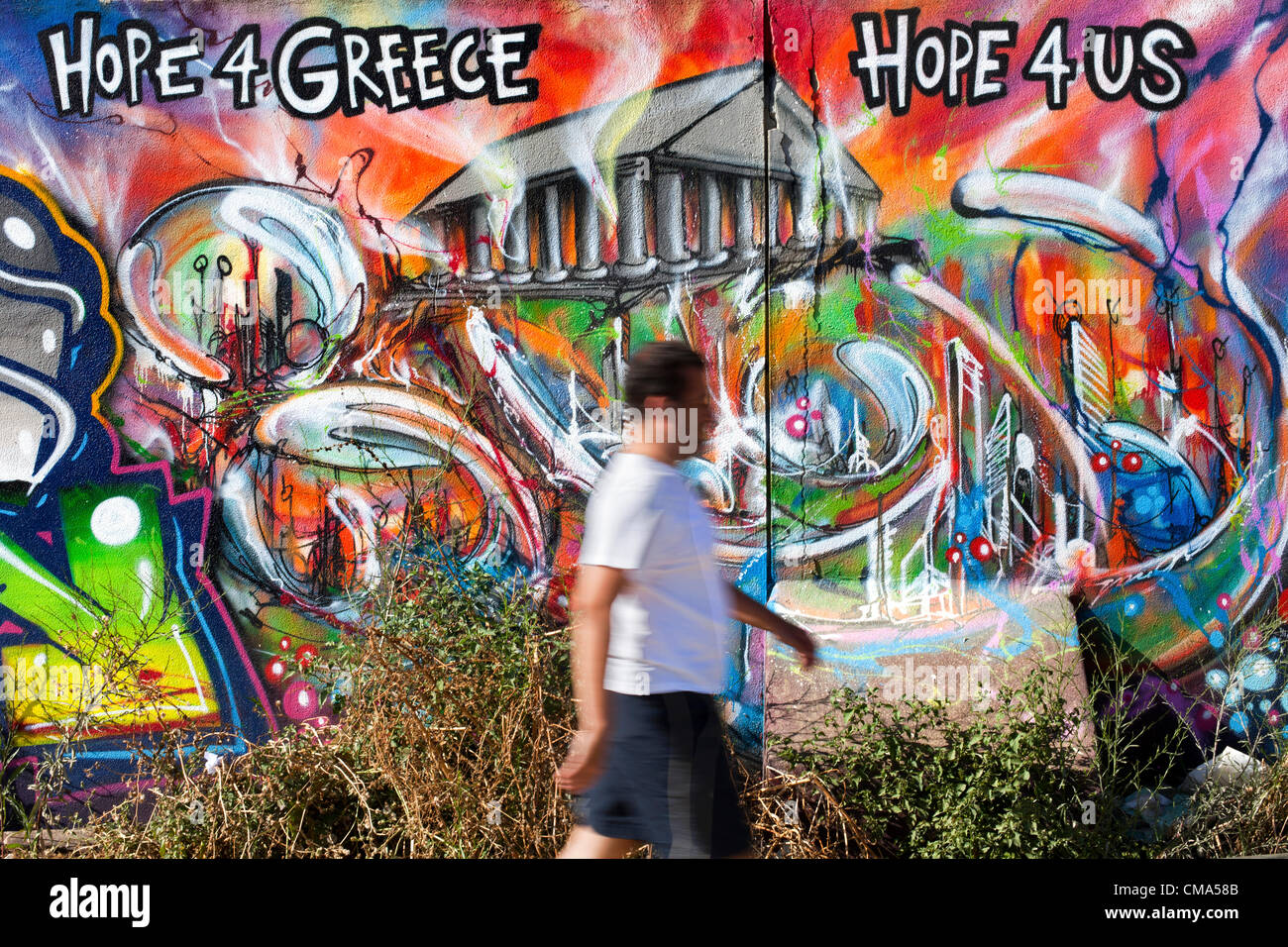 ' Hope for Greece, Hope 4 Us ', says a graffiti on a wall in Lisbon, Portugal, July 1, 2012. Stock Photo