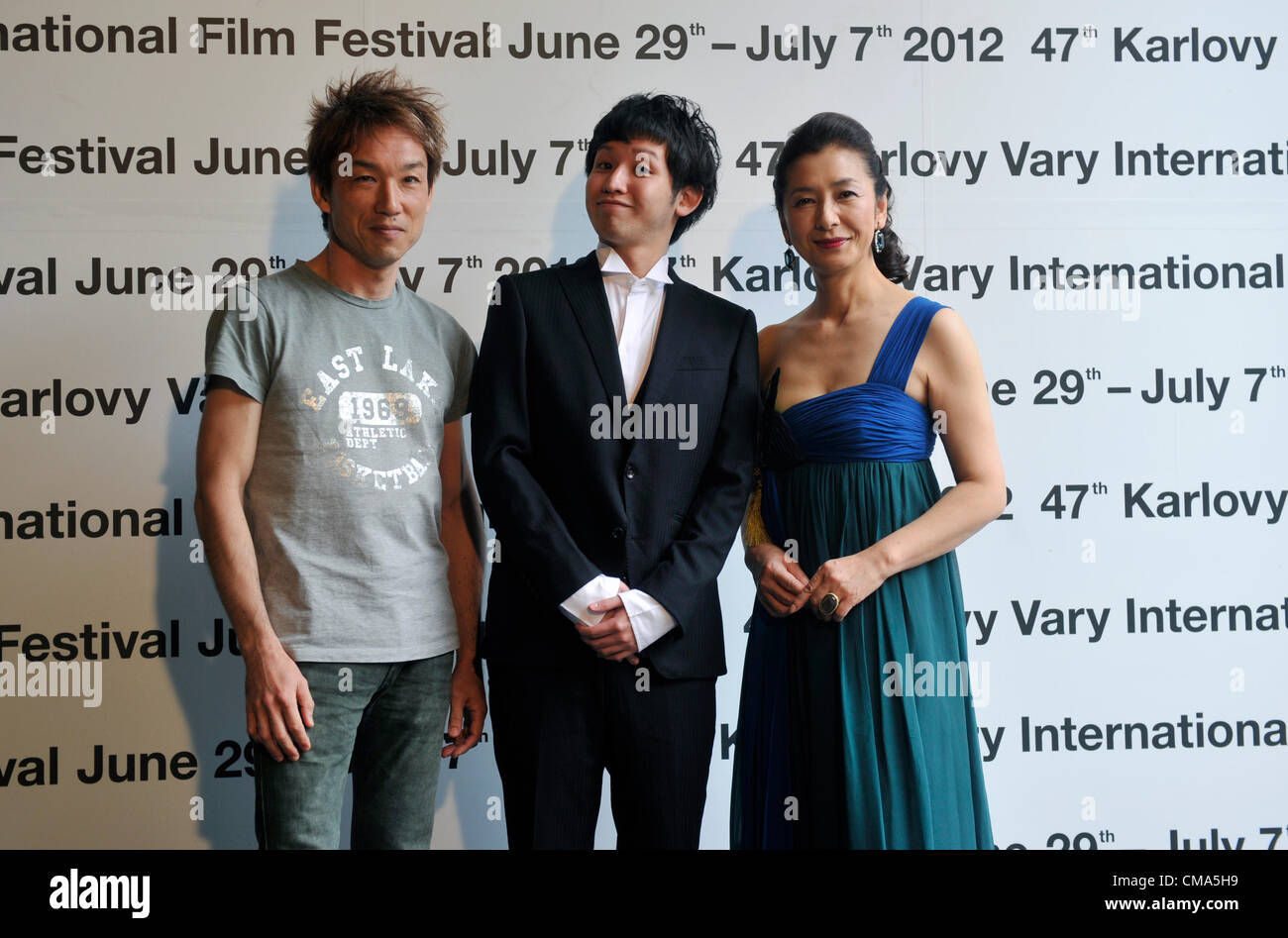 Director Tacuja Jamamoto (left to right) and actors Kento Fukaja and Keiko Takahashi pose before the screening of the film Kamihate Store during the 47th International Film Festival in Karlovy Vary, Czech Republic, on Monday, July 2nd, 2012. (CTK Photo/Vit Simanek) Stock Photo