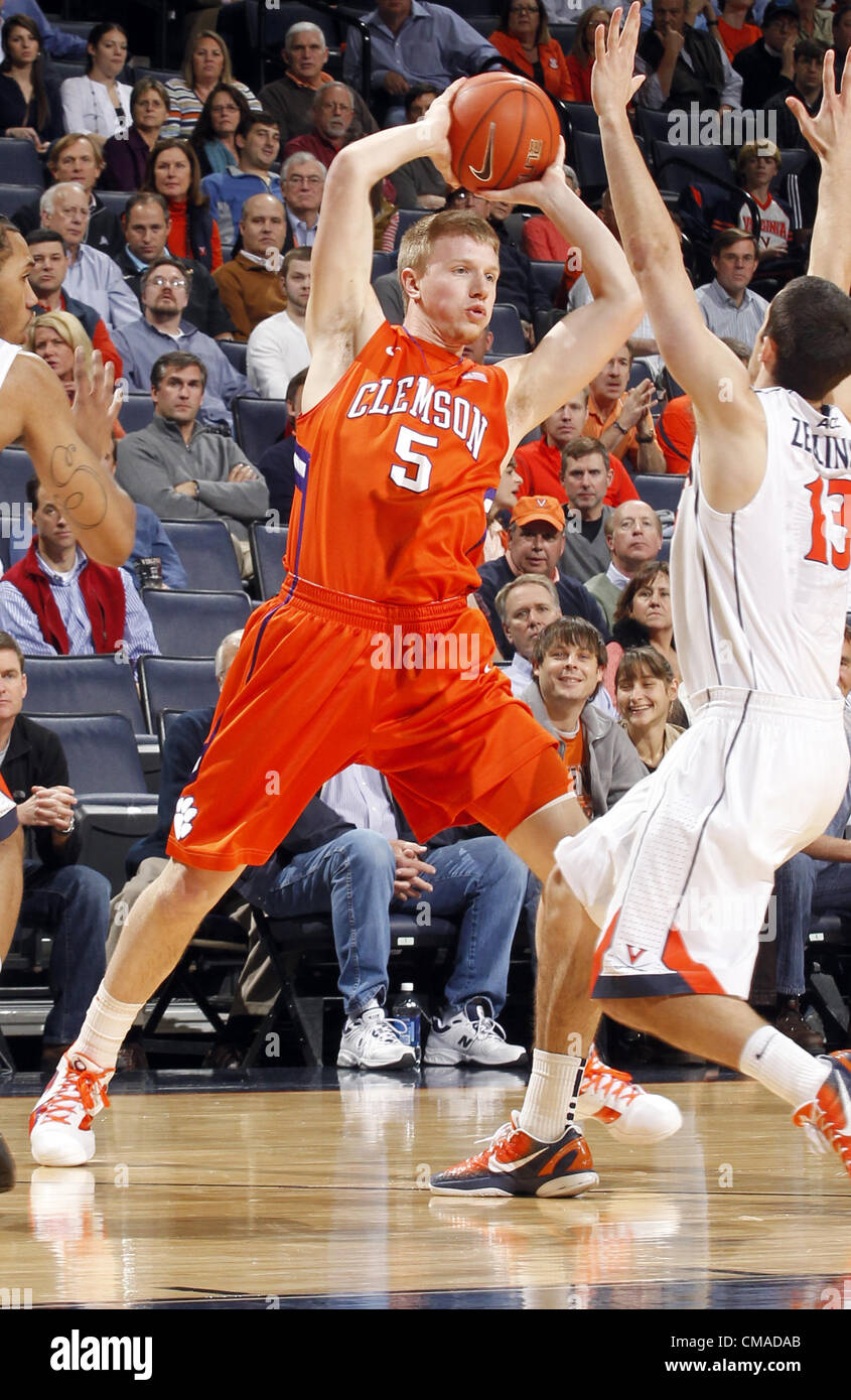 Jan. 31, 2012 - Charlottesville, Virginia, United States - Tanner Smith #5 of the Clemson Tigers handles the ball in front of Sammy Zeglinski #13 of the Virginia Cavaliers during the game at the John Paul Jones Arena in Charlottesville, Virginia. Virginia defeated Clemson 65-61. (Credit Image: © Andrew Shurtleff/ZUMAPRESS.com) Stock Photo