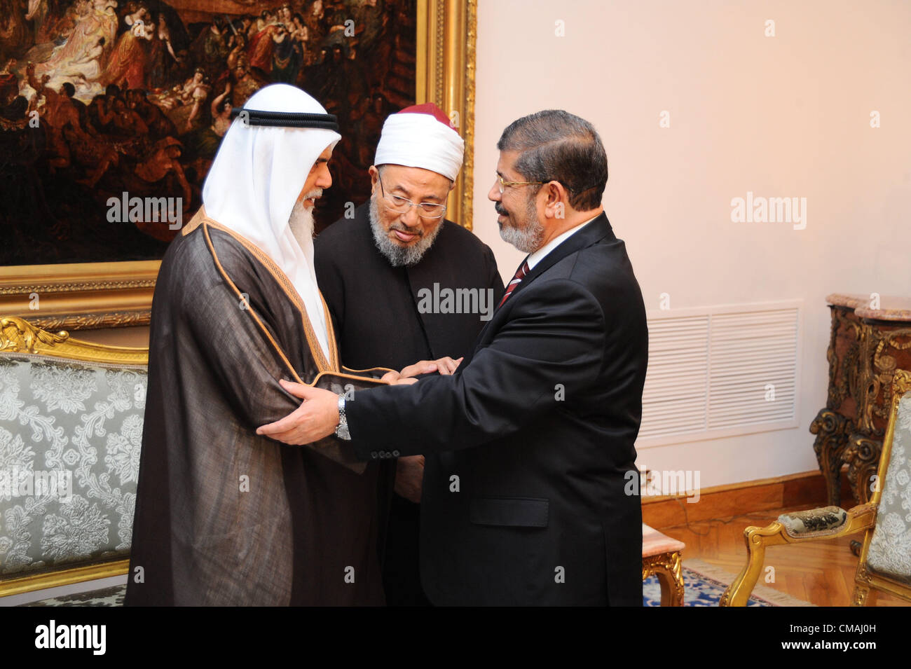 4 July 2012 -- Cairo, Egypt -- Egypt's newly elected President Mohamed Morsi meets Doha based Egyptian Islamist Youssef El Qaradawi and other Islamists, at the Presidential Palace. (Pool/ARE Presidency/Handout) Stock Photo