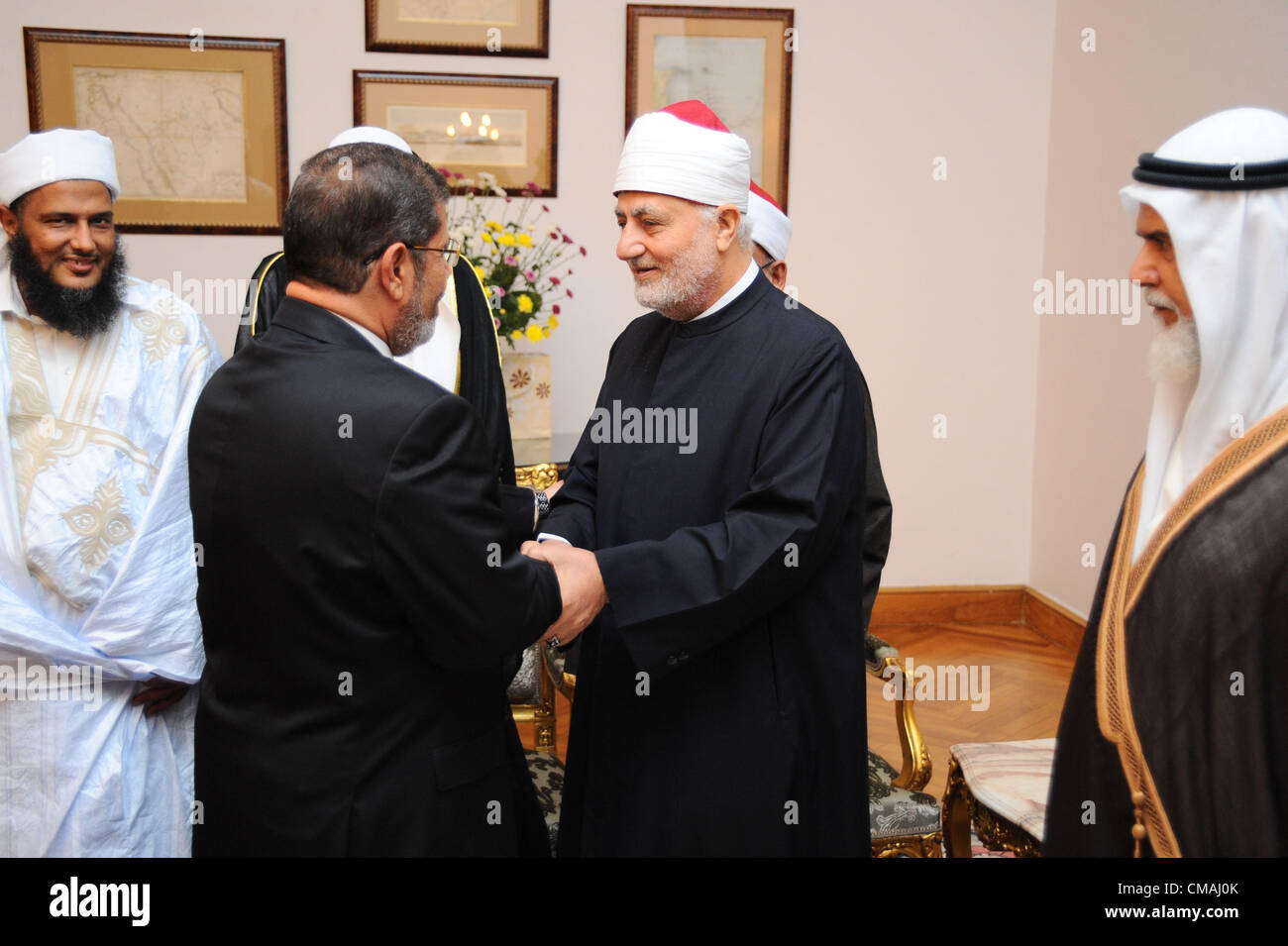 4 July 2012 -- Cairo, Egypt -- Egypt's newly elected President Mohamed Morsi meets Doha based Egyptian Islamist Youssef El Qaradawi and other Islamists, at the Presidential Palace. (Pool/ARE Presidency/Handout) Stock Photo