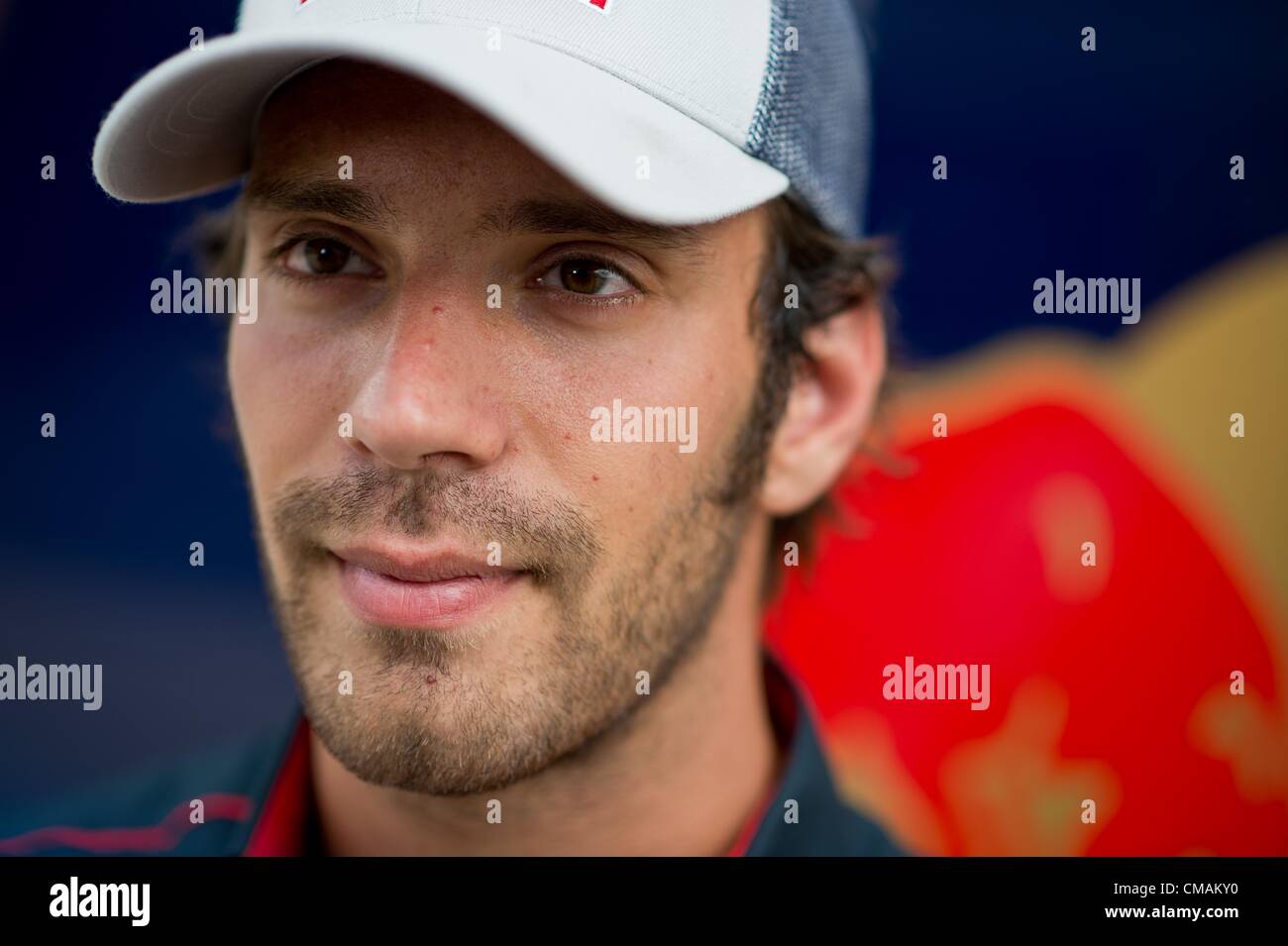 05.07.2012. Silverstone Circuit, Northampton, England. French Formula One driver Jean-Eric Vergne of Toro Rosso talks to journaliste in the paddock at the Silverstone race track in Northamptonshire, Great Britain, 05 July 2012. The Formula One Grand Prix of Great Britain will take place on 08 July 2011. Stock Photo