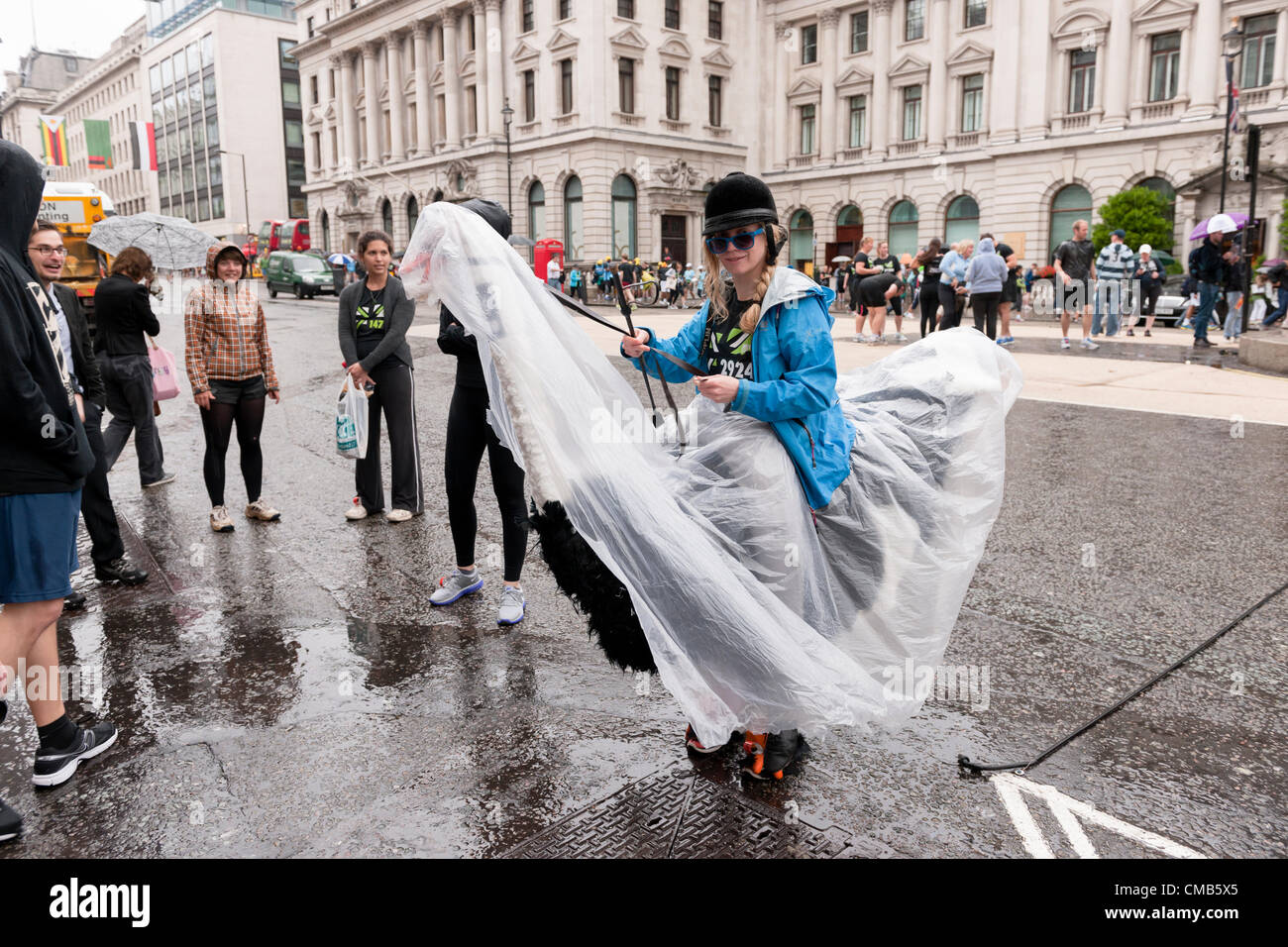 Runner of the Nike sponsored 2012 British 10K run in a ostridge costume  before the race, in Waterloo Place, London, UK, on the 8th of July 2012  Stock Photo - Alamy