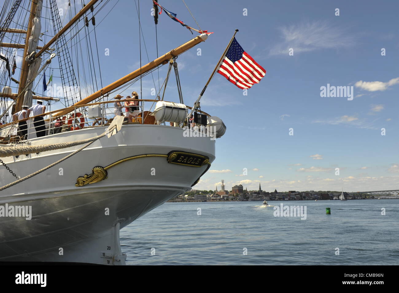 America's tall ship the barque Eagle, a US Coast Guard training vessel docked at Fort Trumbull, New London, Connecticut where it can often be visited in the summer, The US flag, the Stars and Stripes, flies from the stern. Copy space. Original Live News Caption:  New London, Connecticut, USA - July 9, 2012: The stern of the US Coast Guard training ship Eagle with the American flag flying, seen here moored at Fort Trumbull, on the last day of OpSail 2012 CT, celebrating the bicentennial of the War of 1812 and the penning of the Star Spangled Banner. Stock Photo