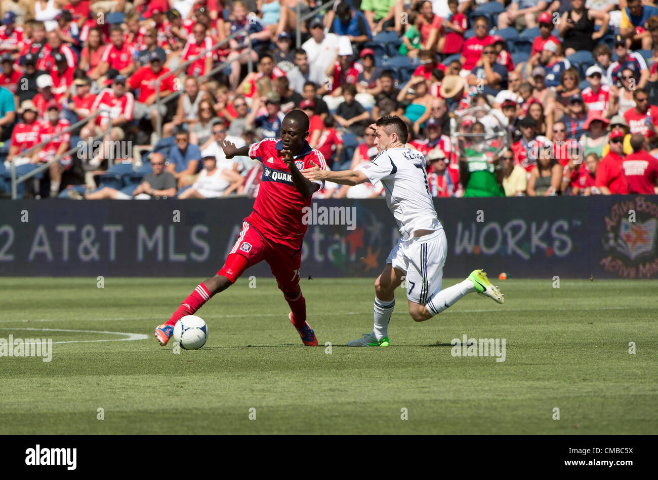 08.07.2012. Chicago, USA.  Patrick Nyarko of Chicago battles Robbie Keane in first half action. The LA Galaxy went on to defeat the Chicago Fire, 2-0 at Toyota Park, Bridgeview, Il Stock Photo