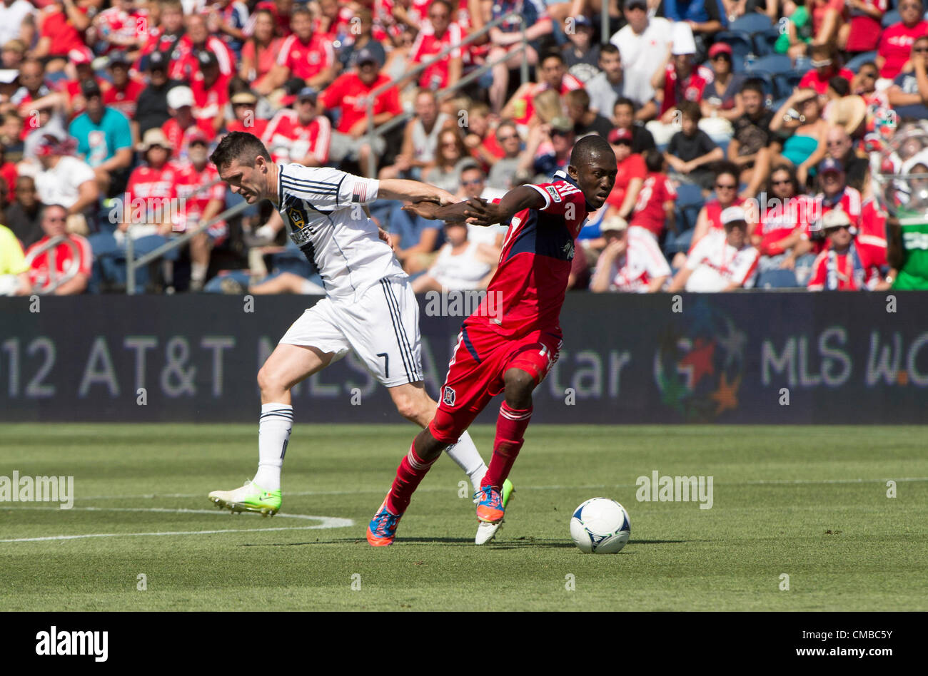 08.07.2012. Chicago, USA.  Patrick Nyarko of Chicago battles Robbie Keane in first half action. The LA Galaxy went on to defeat the Chicago Fire, 2-0 at Toyota Park, Bridgeview, Il Stock Photo