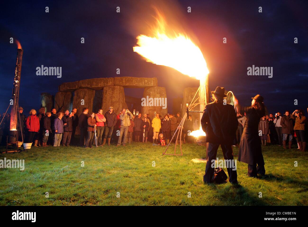 Wiltshire, UK. Tuesday 10th July 2012. French outdoor fire alchemists Compagnie Carabosse present the FIRE GARDEN at the World Heritage Site Stonehenge in Wiltshire.  The performance from the 10th -12th July is part of the London 2012 Festival. Stock Photo