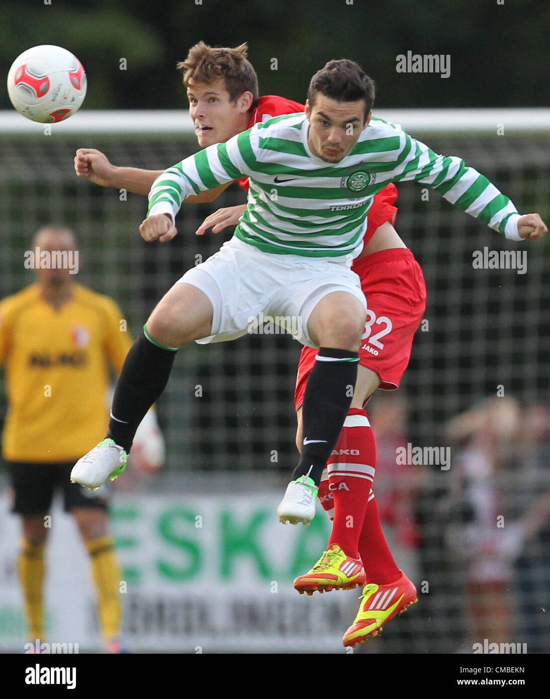 10.07.2012. Donauwoerth, Germany.  Glasgow's Tony Watt (FRONT) and Augsburg's Matthias Strohmaie vie for the ball during a soccer test match between FC Augsburg and Celtic Glasgow in Donauwoerth, Germany, 10 July 2012. Stock Photo