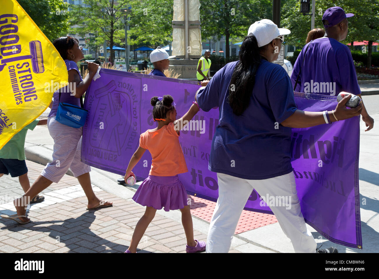 Detroit, Michigan - Janitors march through downtown Detroit, calling for a wage increase in their new union contract. The workers, who clean office buildings, make about $22,000 a year. They belong to Service Employees International Union (SEIU) Local 1. Stock Photo