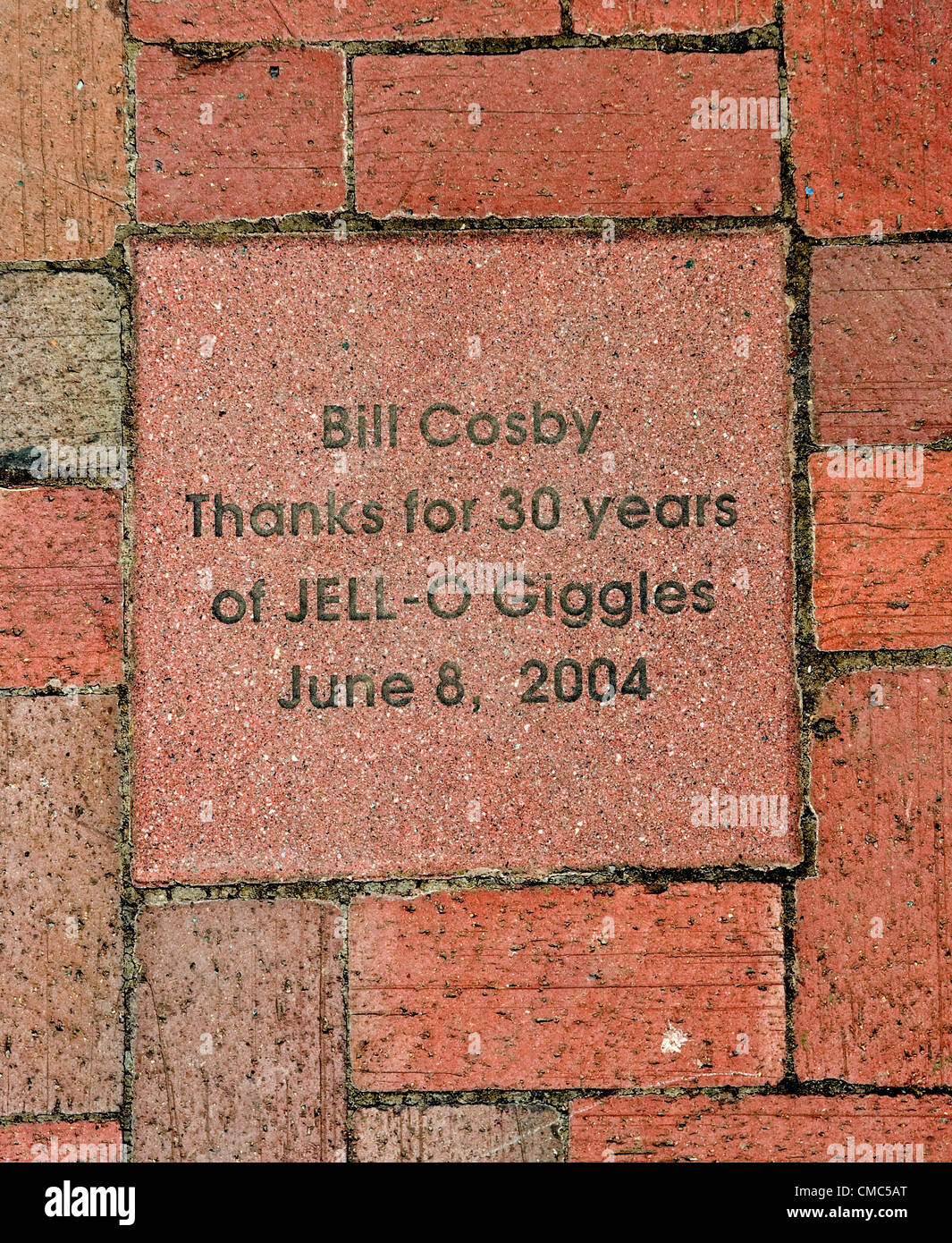 July 14, 2012 Le Roy, NY, USA A brick in the sidewalk commemorating