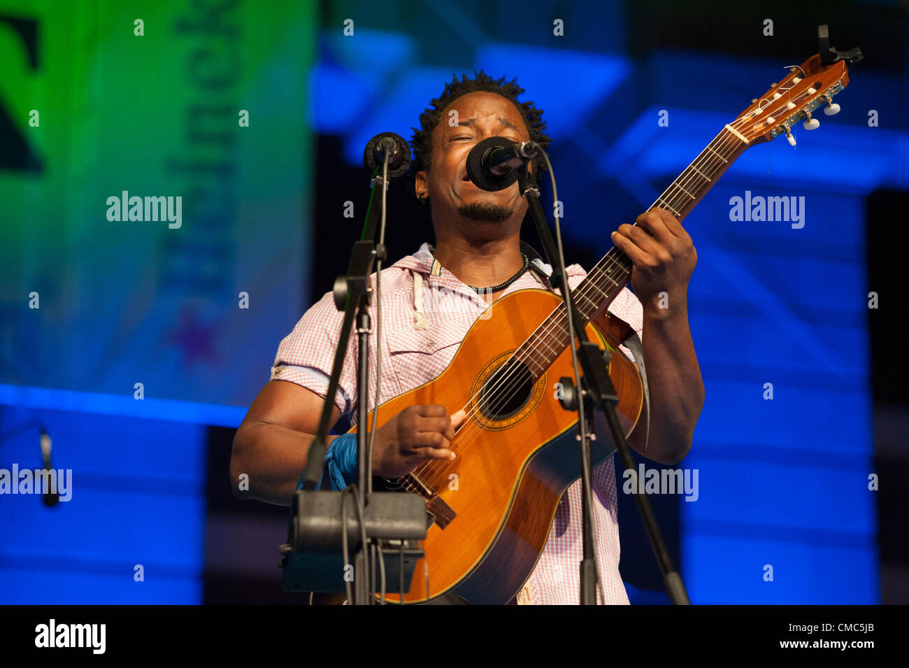 July 14, 2012 – Las Palmas, Canary Islands, Spain – Singer and guitarist Blick Bassy from Republic of Cameroon, onstage during festival international canarias jazz & mas Heineken, in Plaza Santa Ana, Las Palmas, Canary Islands, on Saturday 14 July 2012. Stock Photo