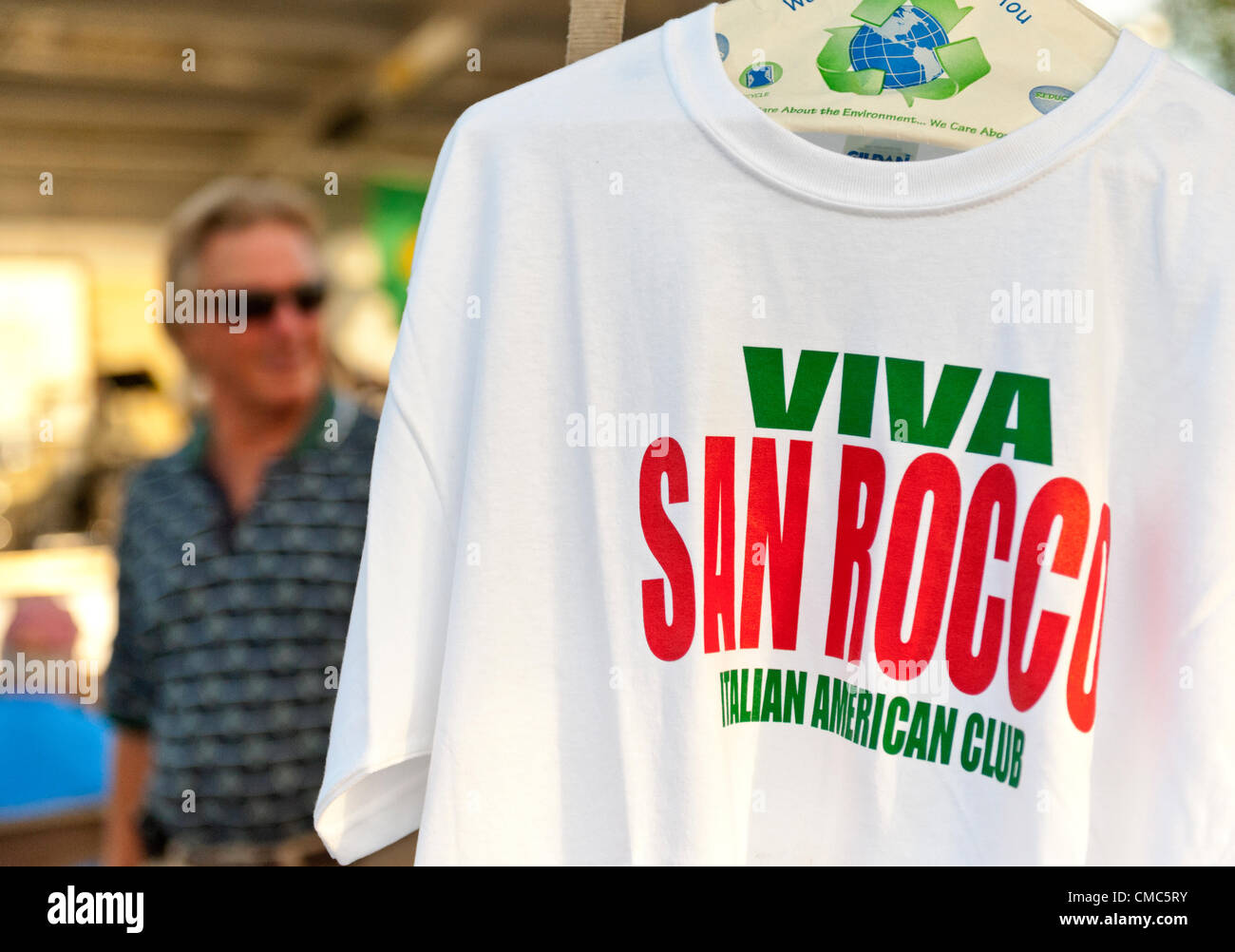 At the Feast of St. Rocco, shirts with 'Viva San Rocco Italian American Club' are for sale, on July 14, 2012, in Oyster Bay, New York, USA. The Italian American Citizens Club organized the five-day festival, which ends July 15, to promote Italian-American heritage. Stock Photo
