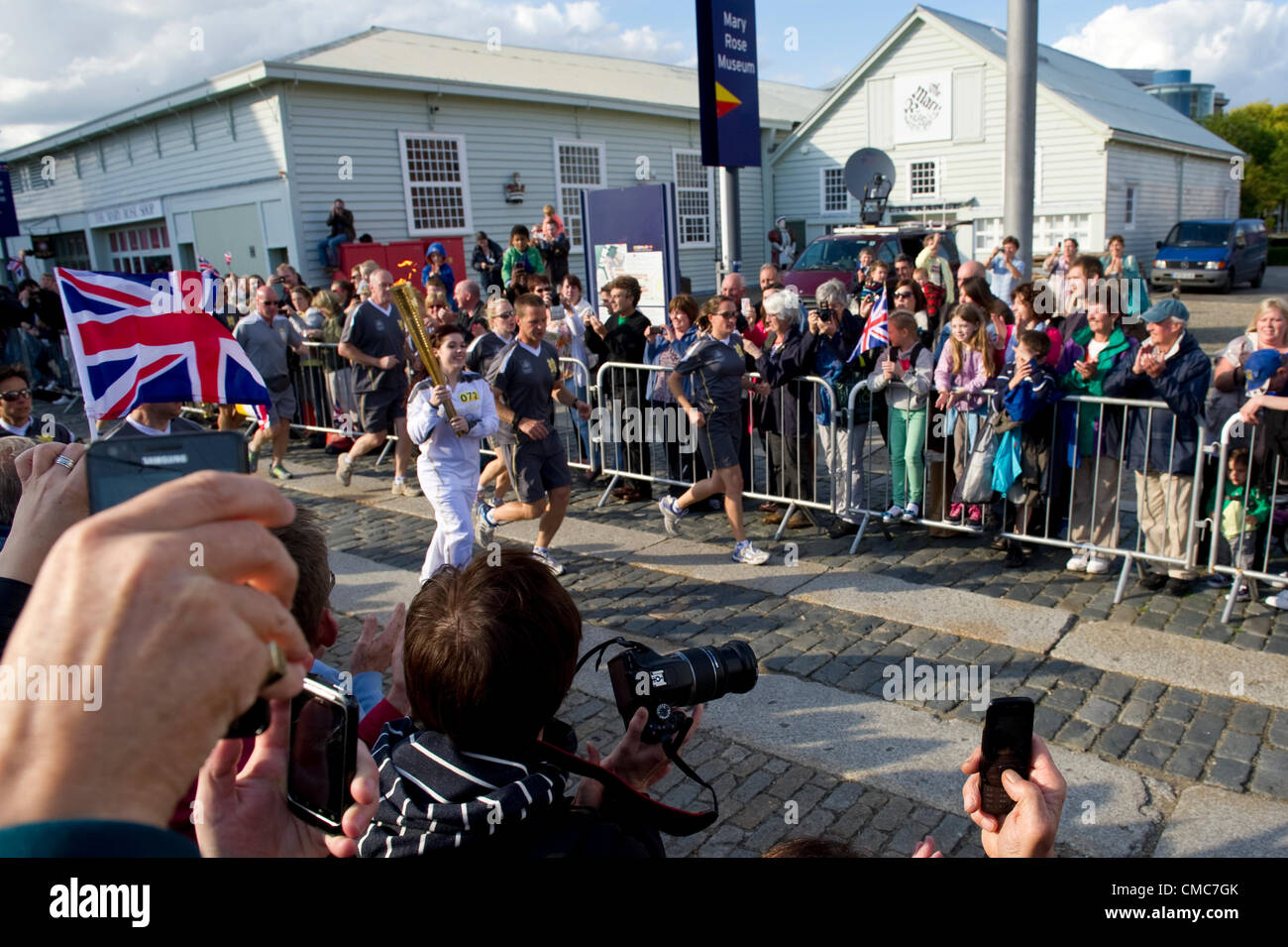 Thousands of people flock to Portsmouth as the Olympic torch crosses