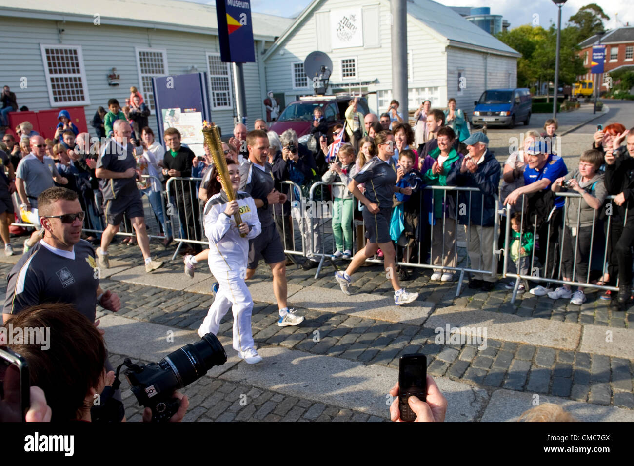 Thousands of people flock to Portsmouth as the Olympic torch crosses