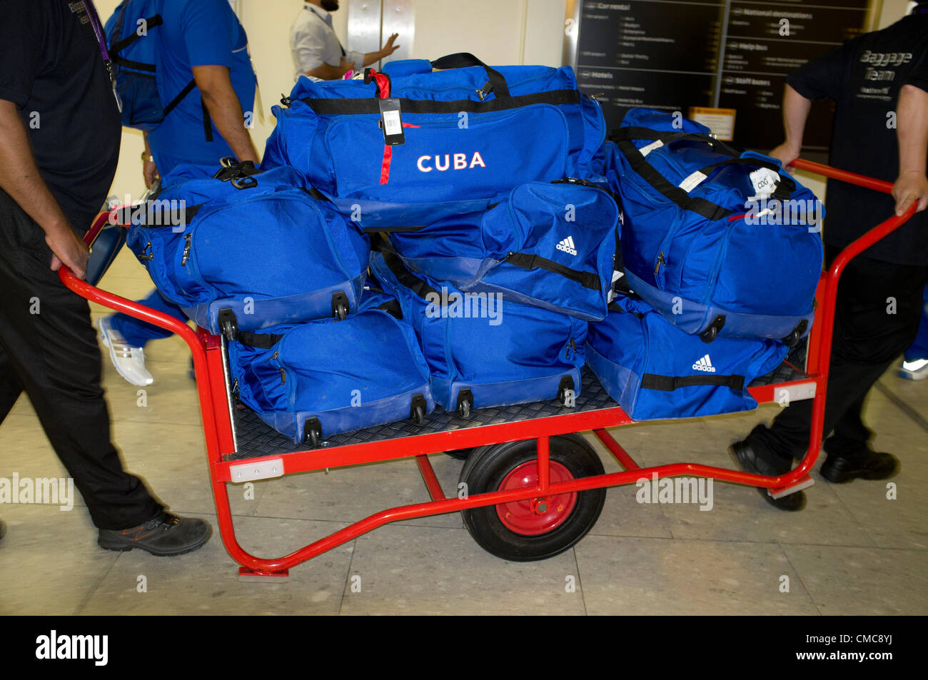 16th July, 2012. Heathrow London UK. Athletes and Officials begin arriving in London at Heathrow airport for the Olympic Games. The Cuban Olympic Weightlifting team with officials land at Heathrow airport. Stock Photo