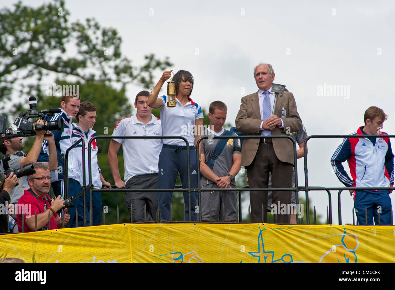 British Olympic gold medalist Dame Kelly Holmes carries the Olympic Torch in Tonbridge, Kent, UK Stock Photo