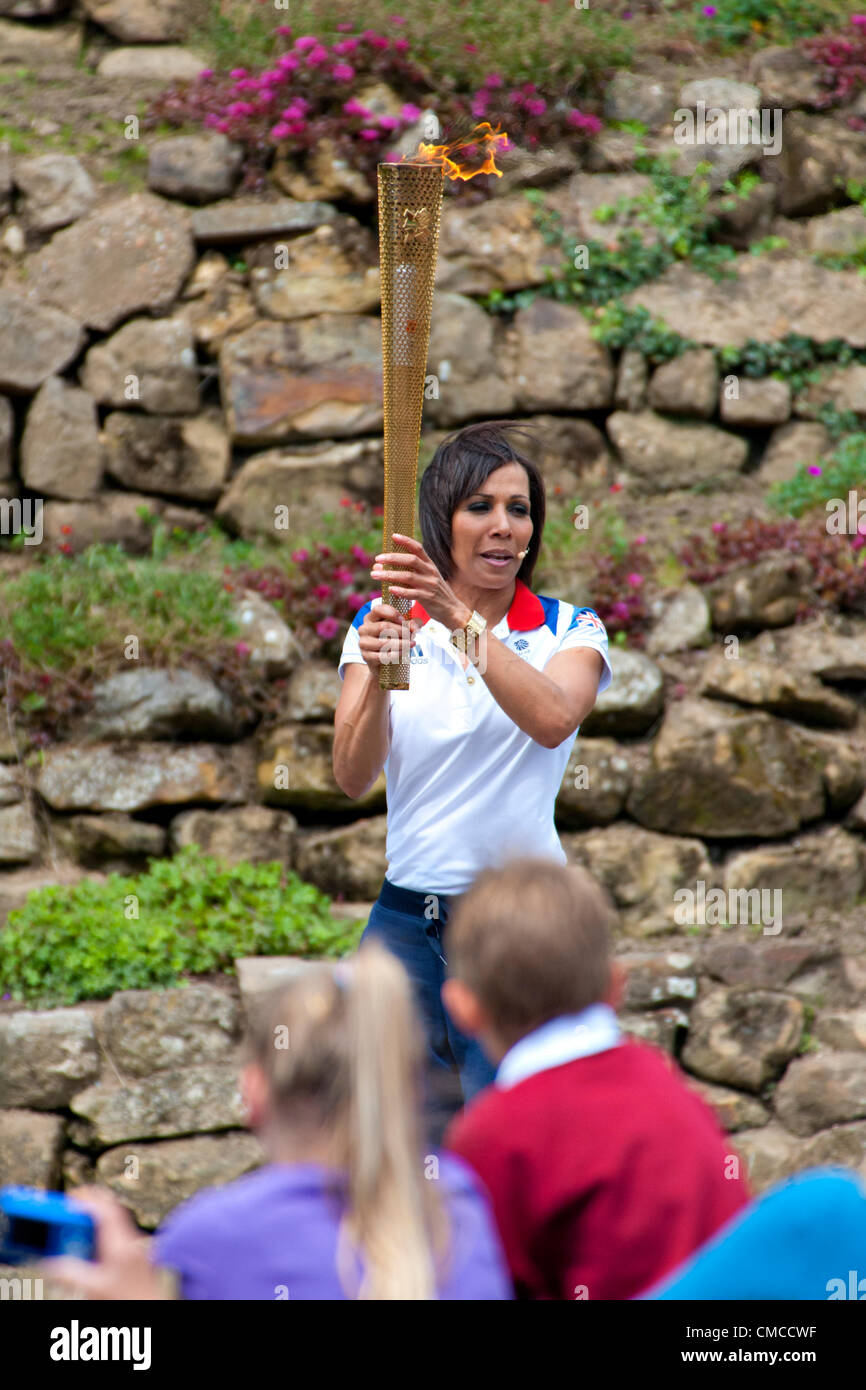 British Olympic gold medalist Dame Kelly Holmes carries the Olympic Torch in Tonbridge, Kent, UK Stock Photo
