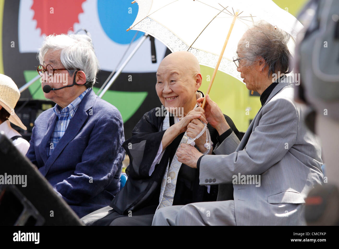 July 16, 2012, Tokyo, Japan - Jakucho Setouchi, Japanese novelist and Buddhist nun is seen during an anti-nuclear rally in Tokyo on Monday, July 16, 2012. Tens of thousands of people, young and old, families and individuals packed Tokyo's Yoyogi Park for Japan's biggest anti-nuclear rally since the Fukushima disaster last year in growing protests against government moves to restart nuclear reactors. The assembly, dubbed '100,000 People's Assembly to say Goodbye to Nuclear Power Plants,' drew a crowd of around 170,000 people, according to organizers. (Photo by Hiroyuki Ozawa/AFLO) [2178] -ty- Stock Photo