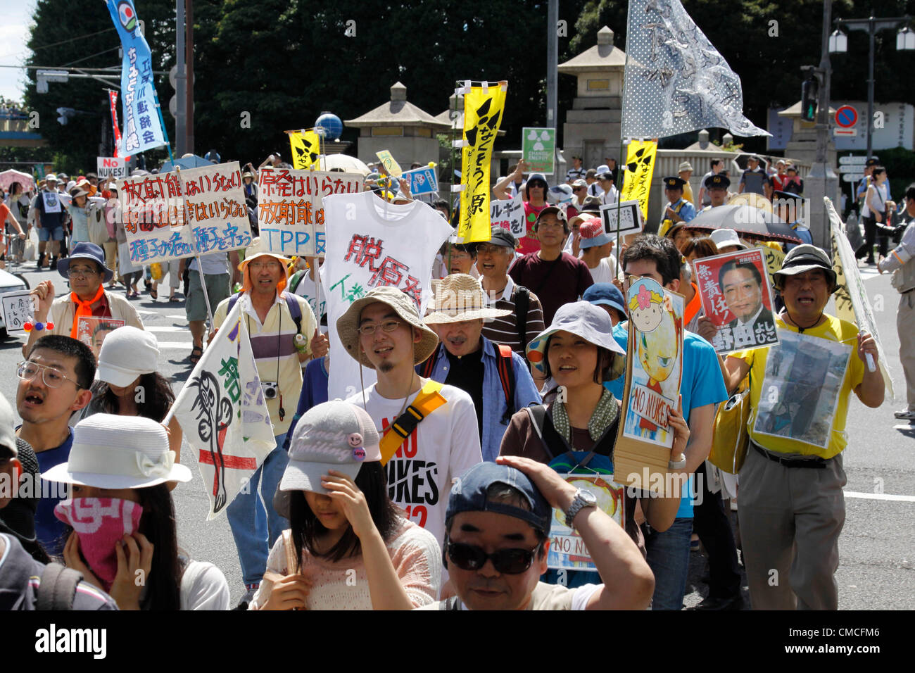 July 16, 2012, Tokyo, Japan - Protesters march on a street during an anti-nuclear rally in Tokyo on Monday, July 16, 2012. Tens of thousands of people, young and old, families and individuals packed Tokyo's Yoyogi Park for Japan's biggest anti-nuclear rally since the Fukushima disaster last year in growing protests against government moves to restart nuclear reactors. The assembly, dubbed '100,000 People's Assembly to say Goodbye to Nuclear Power Plants,' drew a crowd of around 170,000 people, according to organizers. (Photo by Hiroyuki Ozawa/AFLO) [2178] -ty- Stock Photo