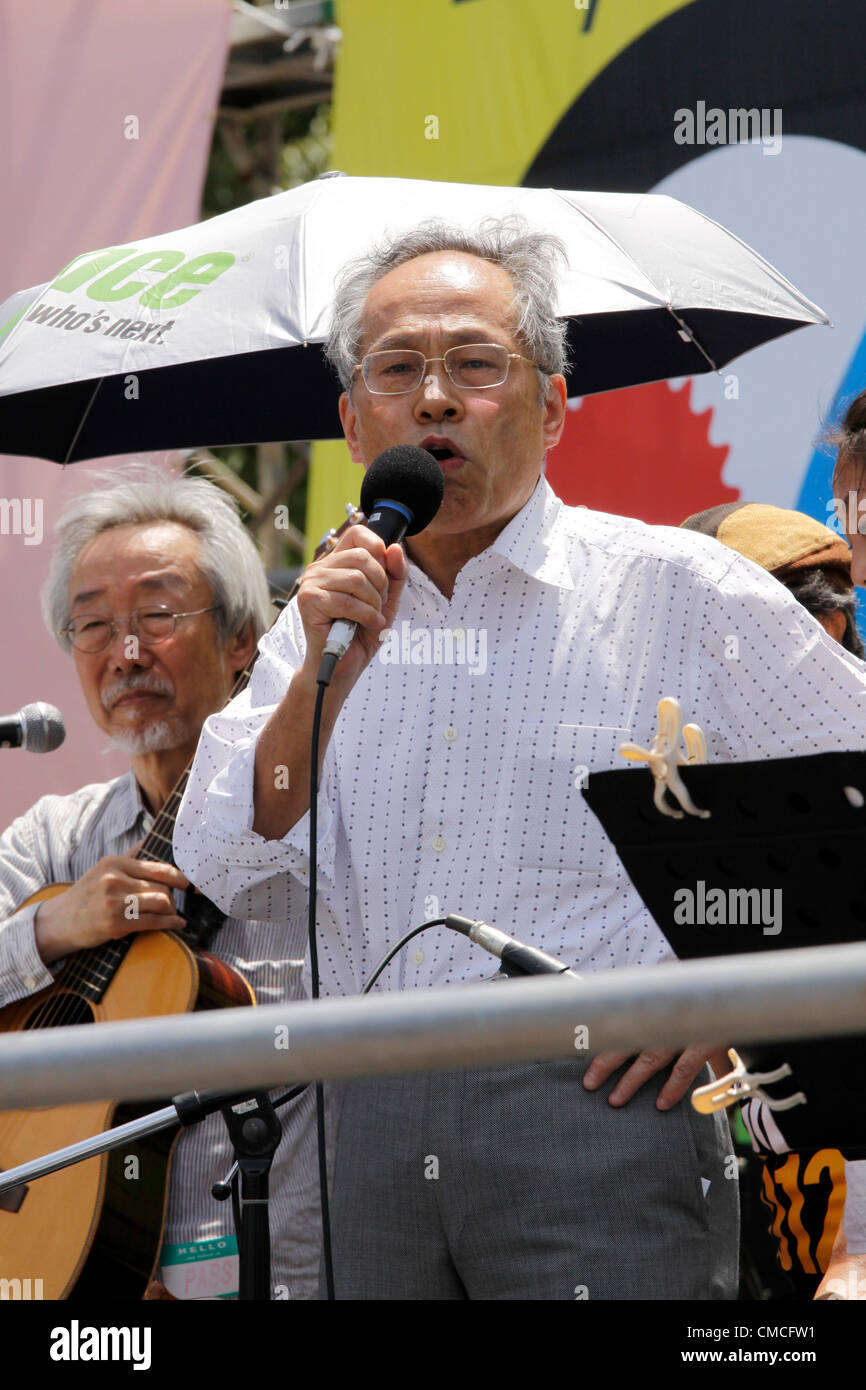 July 16, 2012, Tokyo, Japan - Japanese commentariat, Makoto Sataka addresses the crowd during an anti-nuclear rally in Tokyo on Monday, July 16, 2012. Tens of thousands of people, young and old, families and individuals packed Tokyo's Yoyogi Park for Japan's biggest anti-nuclear rally since the Fukushima disaster last year in growing protests against government moves to restart nuclear reactors. The assembly, dubbed '100,000 People's Assembly to say Goodbye to Nuclear Power Plants,' drew a crowd of around 170,000 people, according to organizers. (Photo by Hiroyuki Ozawa/AFLO) [2178] -ty- Stock Photo