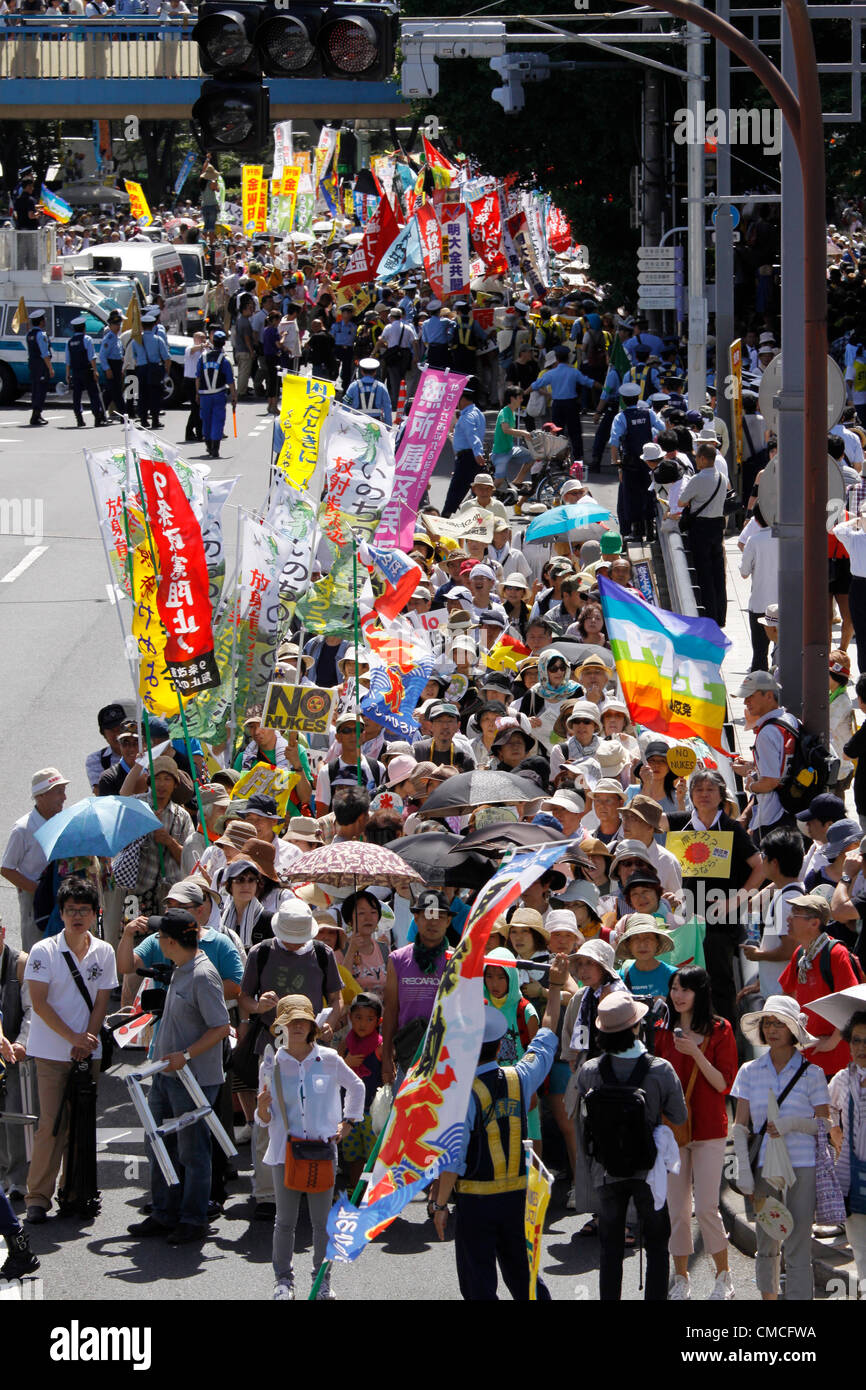 July 16, 2012, Tokyo, Japan - Protesters march on a street during an anti-nuclear rally in Tokyo on Monday, July 16, 2012. Tens of thousands of people, young and old, families and individuals packed Tokyo's Yoyogi Park for Japan's biggest anti-nuclear rally since the Fukushima disaster last year in growing protests against government moves to restart nuclear reactors. The assembly, dubbed '100,000 People's Assembly to say Goodbye to Nuclear Power Plants,' drew a crowd of around 170,000 people, according to organizers. (Photo by Hiroyuki Ozawa/AFLO) [2178] -ty- Stock Photo