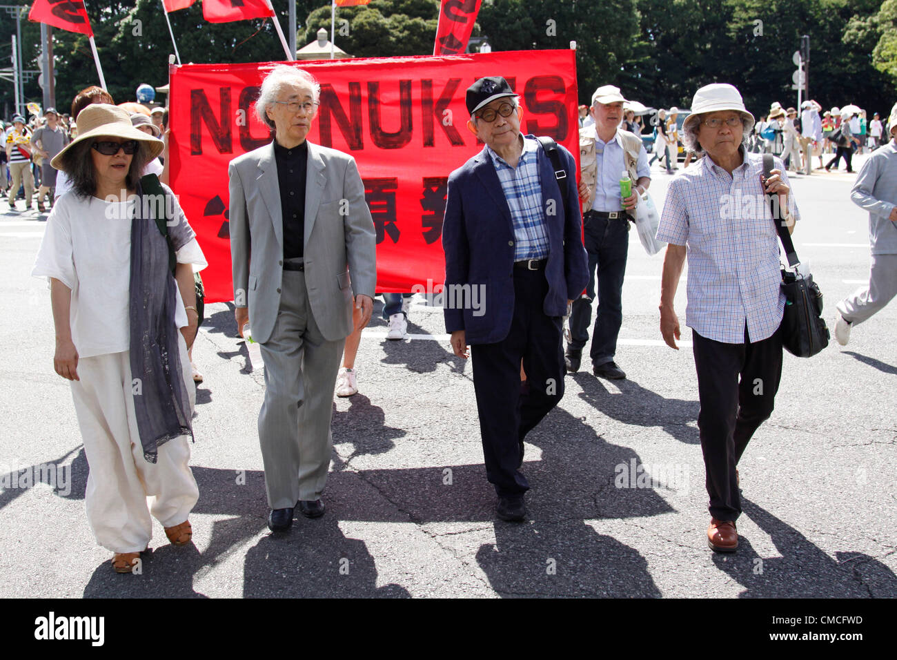 July 16, 2012, Tokyo, Japan - Protesters march on a street during an anti-nuclear rally in Tokyo on Monday, July 16, 2012. Tens of thousands of people, young and old, families and individuals packed Tokyo's Yoyogi Park for Japan's biggest anti-nuclear rally since the Fukushima disaster last year in growing protests against government moves to restart nuclear reactors. The assembly, dubbed '100,000 People's Assembly to say Goodbye to Nuclear Power Plants,' drew a crowd of around 170,000 people, according to organizers. (Photo by Hiroyuki Ozawa/AFLO) [2178] -ty- Stock Photo