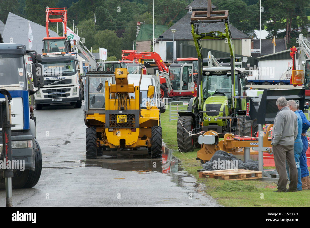 July 18th 2012. Builth Wells, Wales, UK. New agricultural machinery arrives at the showground for the Royal Welsh Showground. Organisers are optimistic for fine weather next week when The Royal Welsh Show starts on Monday 23rd July 2012. Stock Photo