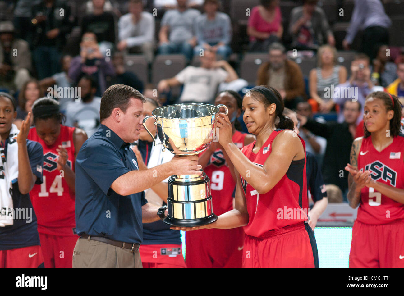 Manchester Evening News Arena, Manchester, UK, 18th July 2012. Jim Tooley, CEO USA Basketball, presents Maya Moore with the MVP trophy after USA defeated Great Britain at the MEN Manchester in a warm up match for the 2012 Olympics. Credit: Colin Edwards/Alamy Live News Stock Photo