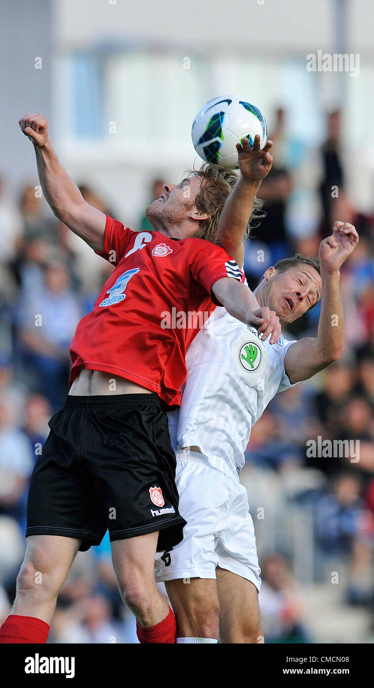 The European Football League, 2nd qualifying round opening match, FK Mlada Boleslav vs Thor Akureyri, Mlada Boleslav, Czech Republic, on Thursday, July 19, 2012. Radek Sirl of Mlada Boleslav, right, and Armann Aevarsson of Thor Akureyri. (CTK Photo/Radek Petrasek) Stock Photo