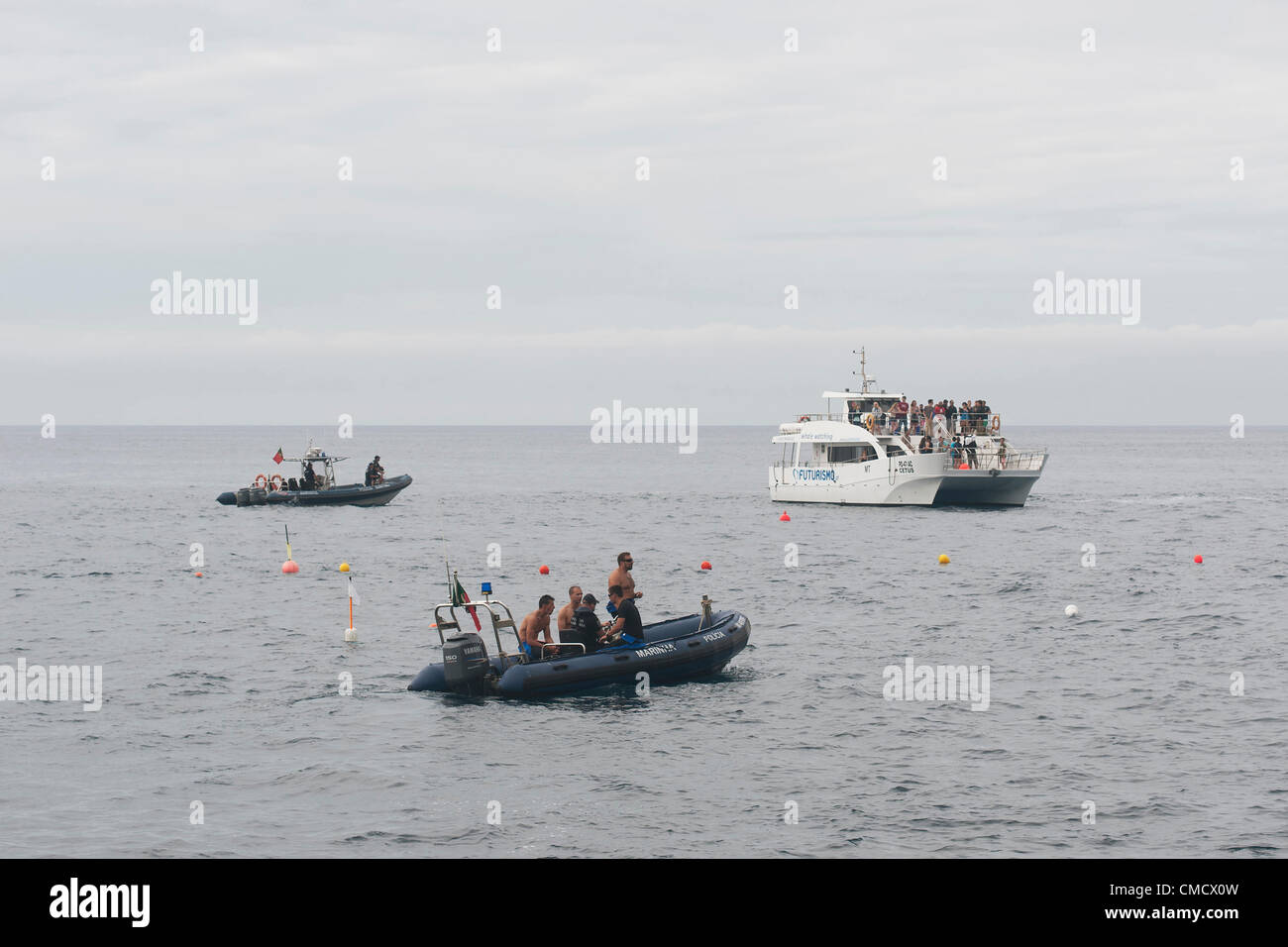 Franca do Campo, Azores. 20th July, 2012. Red Bull Cliff Diving, Day I: practice at 28 meters. police boats and media / vip boat Stock Photo