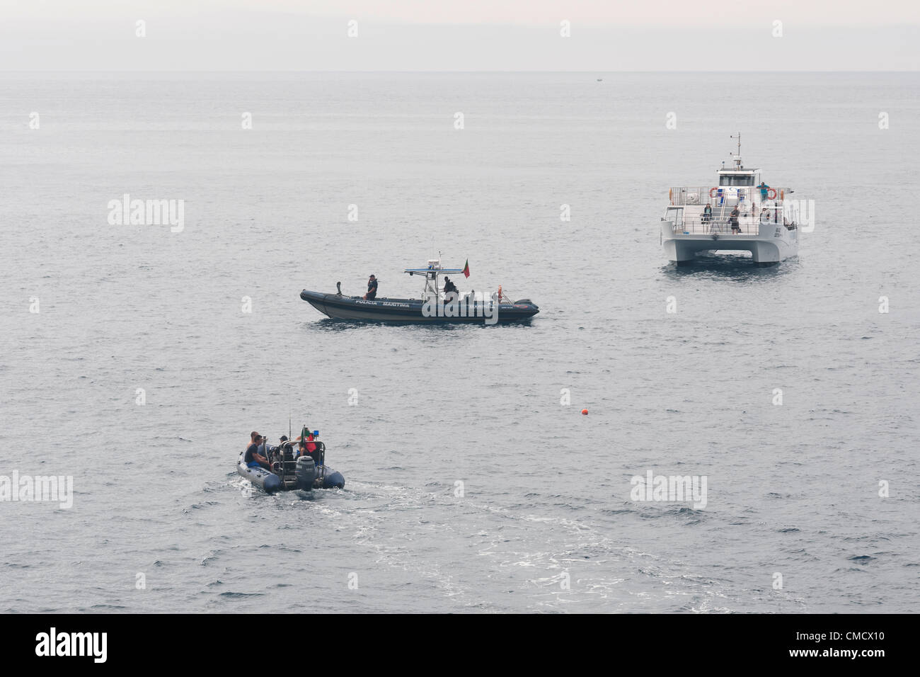 Franca do Campo, Azores. 20th July, 2012. Red Bull Cliff Diving, Day I: practice at 28 meters. Police boats and media / vip boat Stock Photo