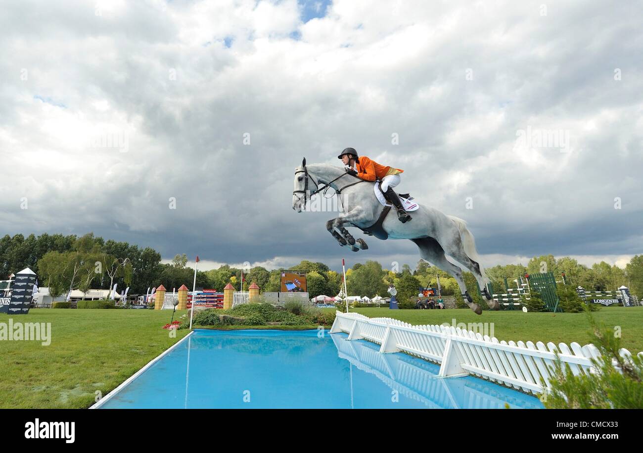 20.07.2012 The All England Jumping Course  Hickstead, England.  Hendrick-Jan Schuttert stops at the Hickstead planks during The FEI Nations Cup at The Longines Royal International Horse Show. Stock Photo