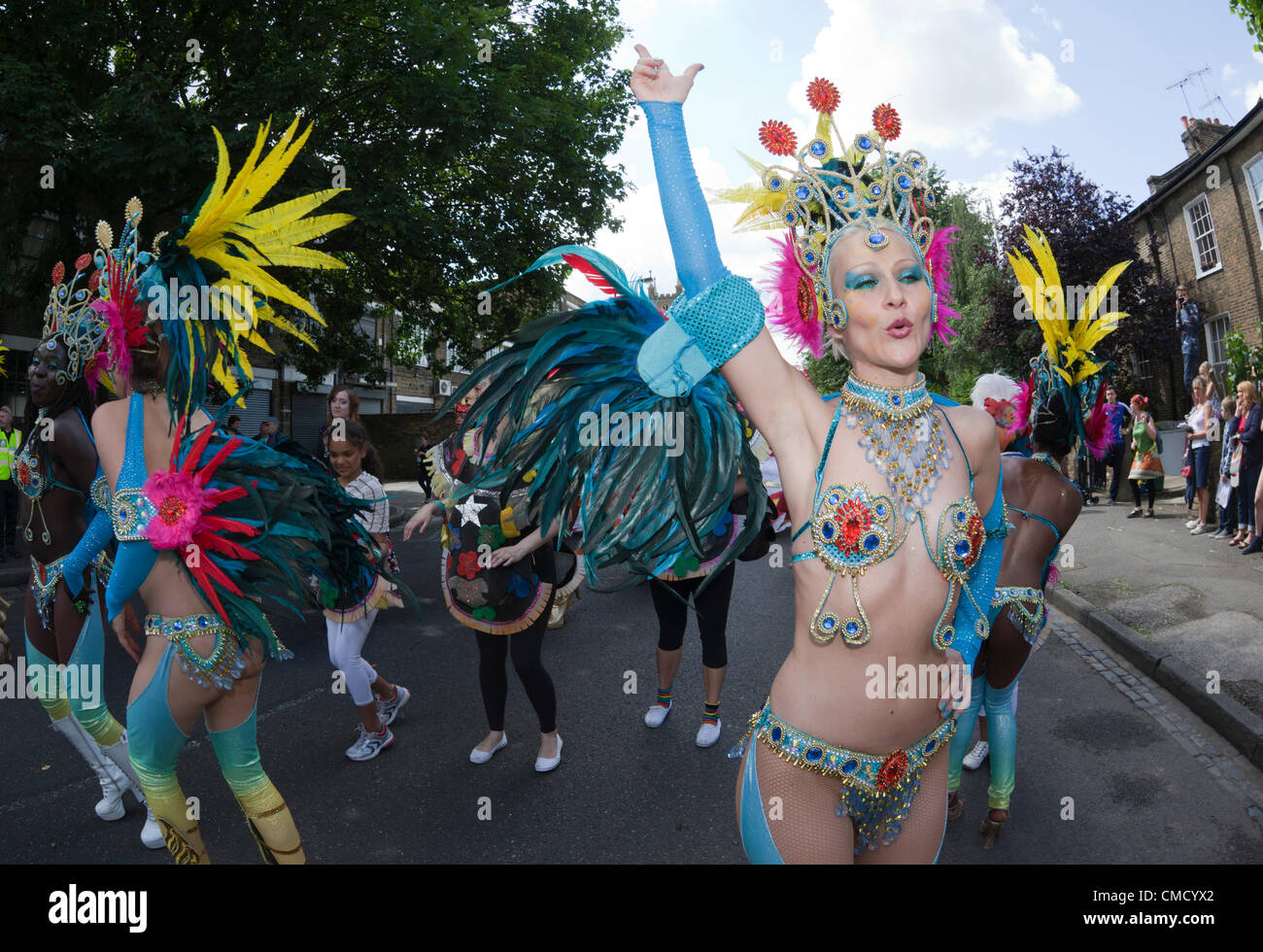 Hackney, London, UK. Saturday, 21 July 2012. Carnival Parade from Pitfield Street to Stoke Newington at the One Hackney Festival 2012. The festival is an all-day borough wide event taking place on Saturday, 21 July 2012 to welcome the Olympic Torch on its first day in London. Samba Dancers from the London School of Samba Stock Photo