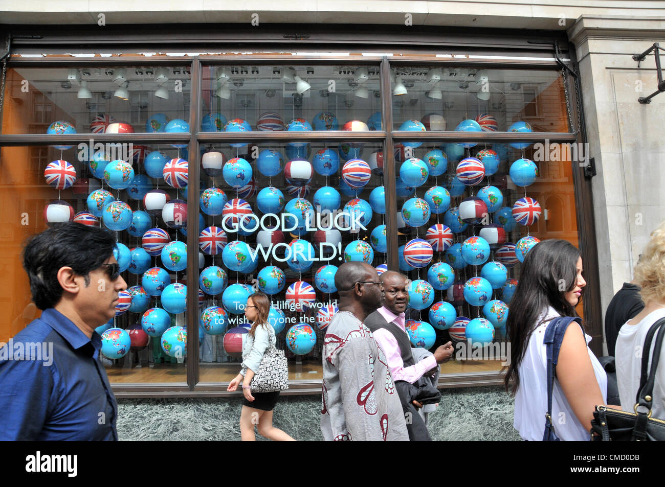 Regent Street, London, UK. 21st July 2012. Tommy Hilfiger store on Regent  Street as its shops are decorated with Olympics and sports related flags,  adverts and window decorations, in a bid to