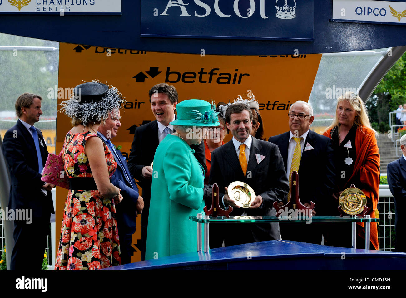 21.07.2012 Ascot, England. The King George VI and Queen Elizabeth Stakes. Her Royal Highness Queen Elizabeth present a cup to  Mr  Gestut Burg Ebstein co-owner of the winning horse Danedream,  at the Ascot Betfair Weekend Featuring Property Raceday. Stock Photo