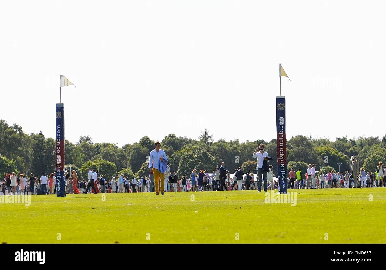 22.7.2012. Egham, Surrey, England. Spectators put back the divots at ...